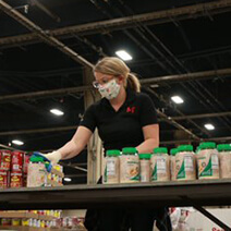 An associate working at a food bank