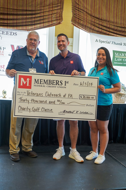 Members 1st CEO and Associate Presenting Check to Veterans Outreach of Central PA