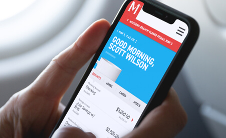 Image containing a mobile phone accessing the Members 1st app