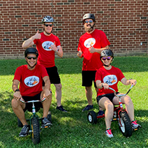 A group of people sitting on bikes